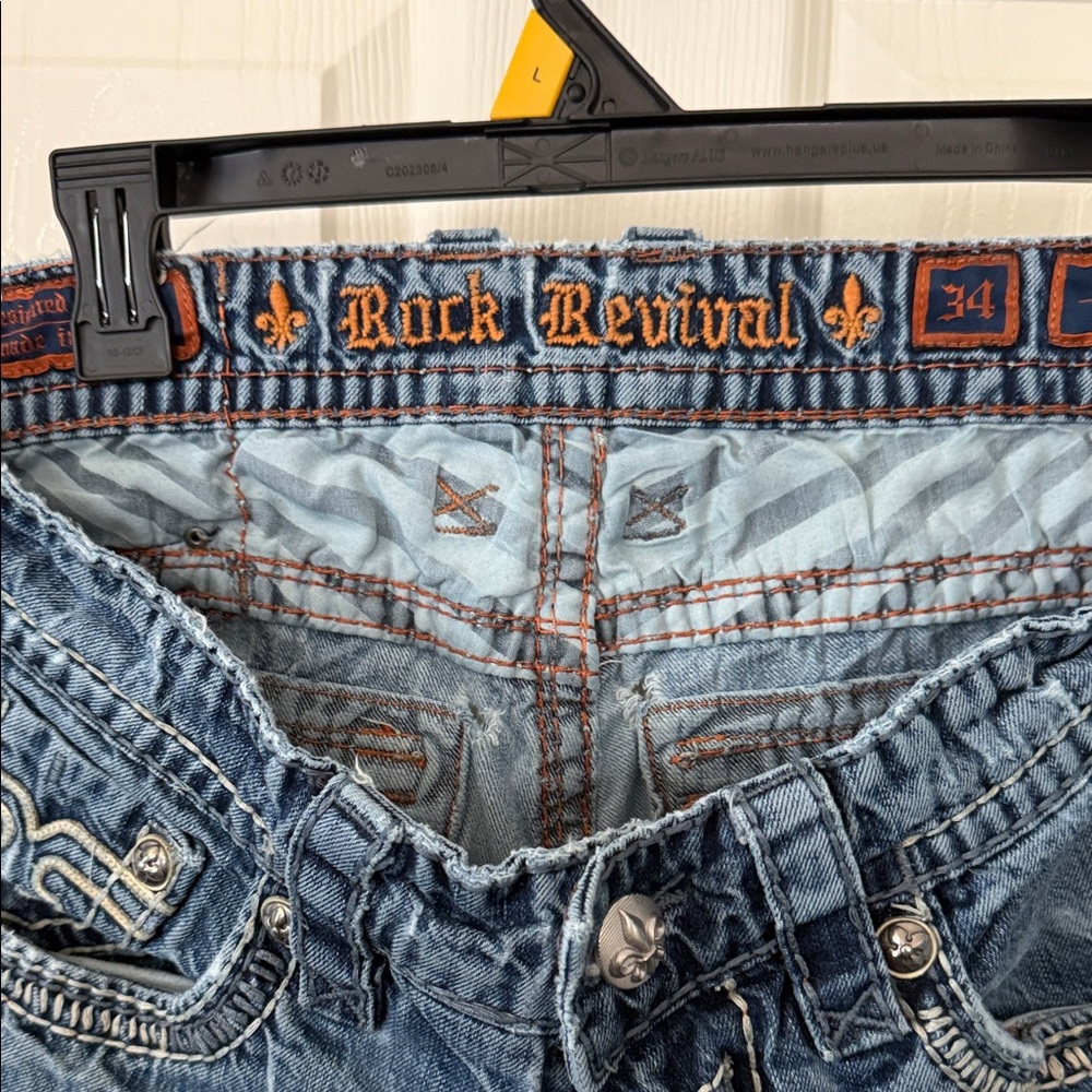 Rock Revival Men’s Light Blue Distressed Slim Jeans with Orange Stitching